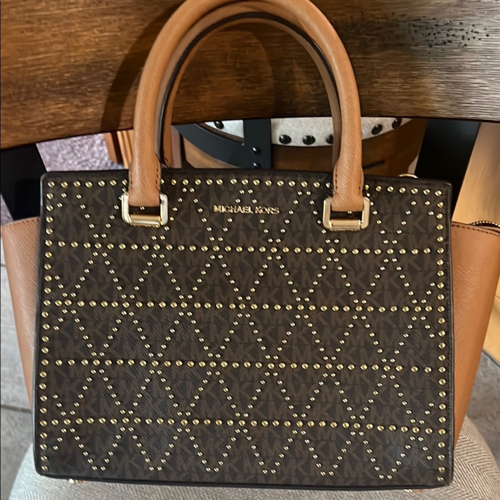 Michael Kors Brown and Tan Studded Satchel
11’9 inside zipper and wristlet .